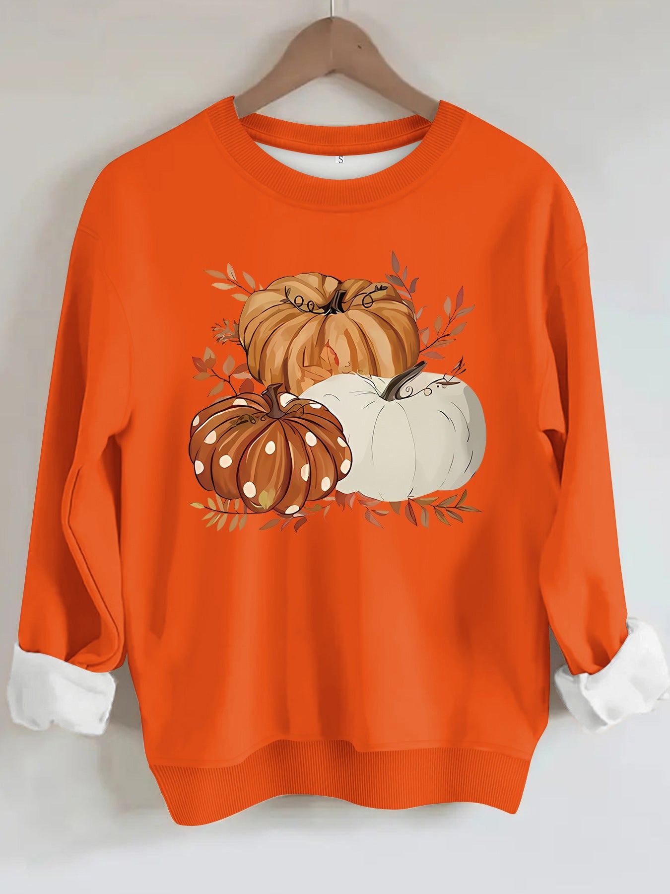 Three pumpkin patterned printed hoodies