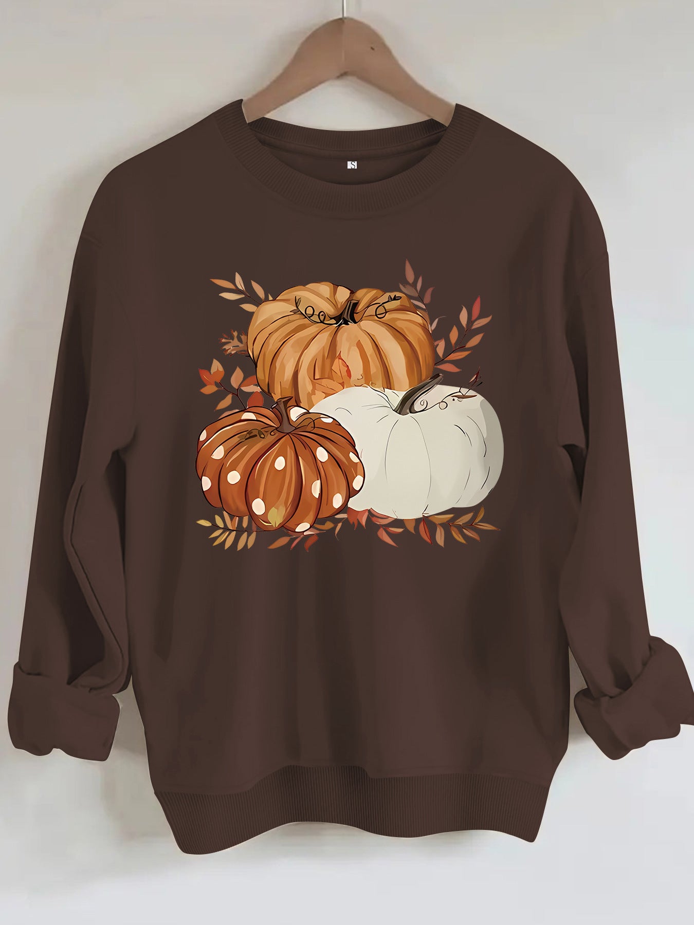 Three pumpkin patterned printed hoodies
